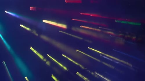 In the Shot on a Blue Dark Background Bright Light That Breaks Through the Smoke Clouded Background