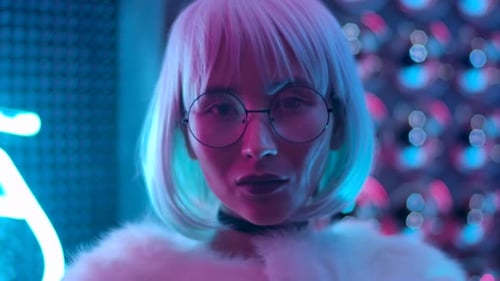 Stylish woman with bob haircut and round glasses