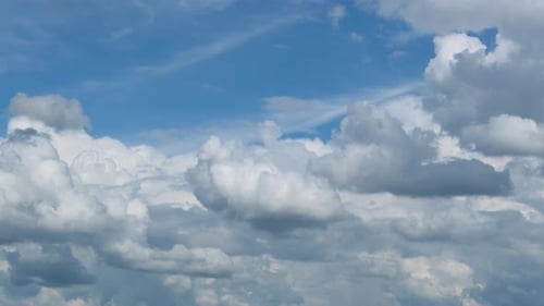 Blue sky with fluffy cloud time lapse on a sunny day 4k footage.