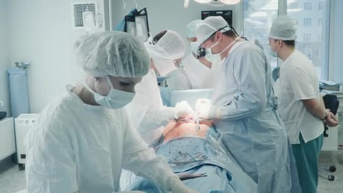 Surgical Team Performing Operation in Operating Room