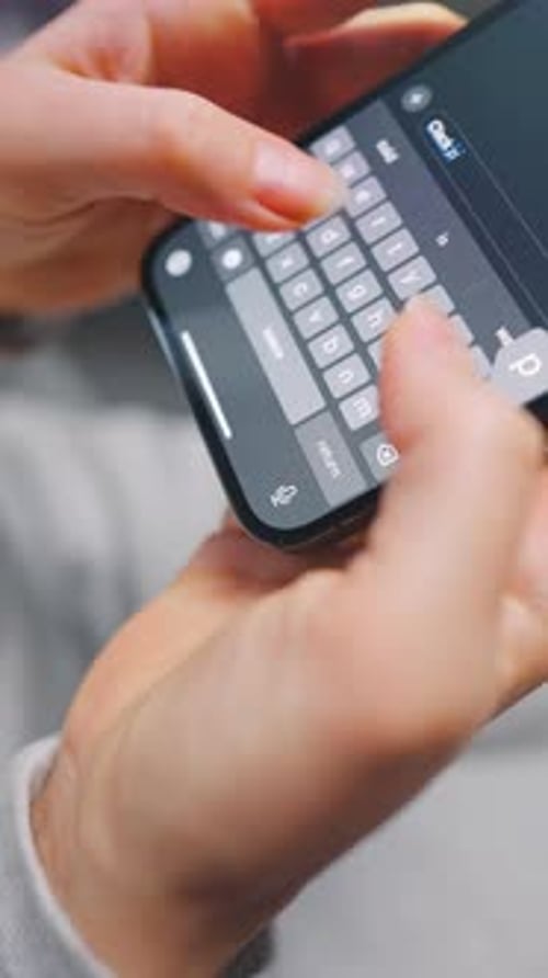 Female Hands Typing Text on Smartphone Closeup Vertical