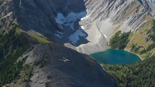 A thrilling helicopter tour of the Canadian Rocky Mountains, breathtaking aerial views of snow-cappe