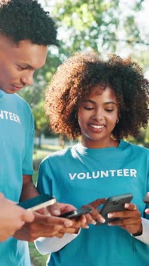 Volunteer group, people and phone at park with laughing, charity event update or funny NGO website