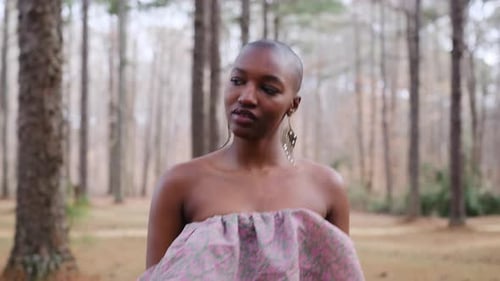 Beautiful Bald African American Woman Posing Outdoors in a Forest