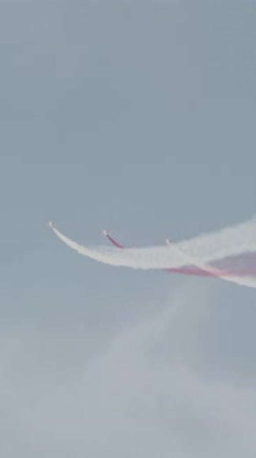 Planes Performing Airshow in Sky with Smoke Trails