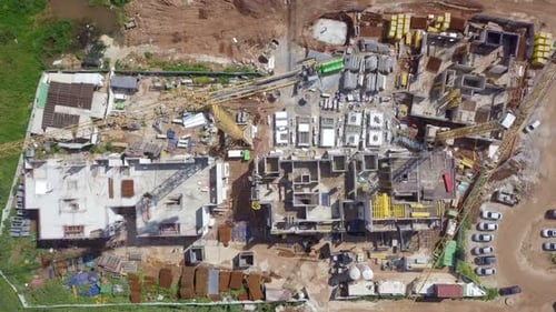 Large residential construction site with cranes, Aerial view