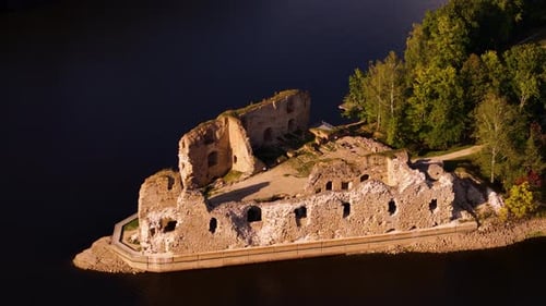 Historic Ruins Of Koknese Castle On A Sunny Day In Koknese, Latvia. - aerial shot