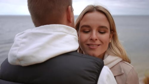 A Couple is Having a Meaningful Conversation While Enjoying the Beautiful Ocean View