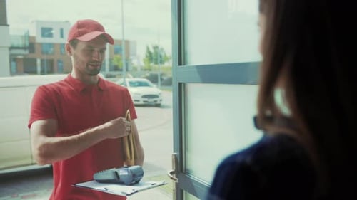 Indoor Pickup with Payment and Friendly Service Customer Receives Card From Courier at Indoor Window