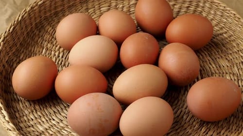 Brown eggs in the basket. Dietary products. Organic fresh eggs.