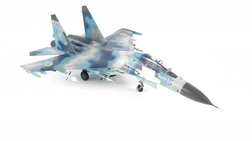 Rotating Assembly Model Of Su 27 Fighter Airplane On White Background.