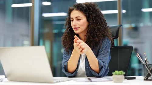Confident Businesswoman in Modern Office on Video Conference Call