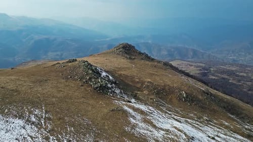 Mountain Summit and Distant Mountain Range Aerial