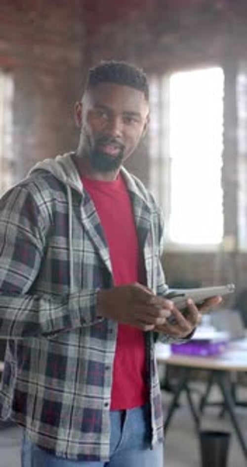 Man Uses Tablet in Modern Office Environment