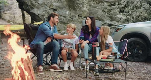 Family Enjoys Campfire in the Great Outdoors