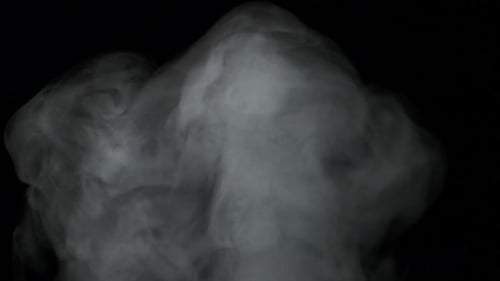 Billowing White Smoke Against Black Background