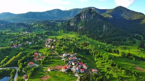 View From Rock to Town of Smolyan with Meadows for Cattle Walking and Houses Between Mountain Range
