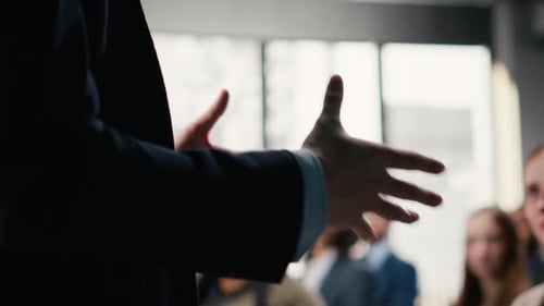 Business Summit in Conference Hall with Professional Audience Seated on Chairs