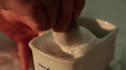 Barber Hands Prepare Vintage Wet Shaving Brush in Ceramic Bowl