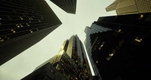 Skyscrapers Stretch Upwards Beneath a Moody Sky in an Urban Landscape