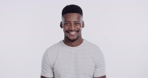 Friendly Young Man Smiling in Studio Portrait