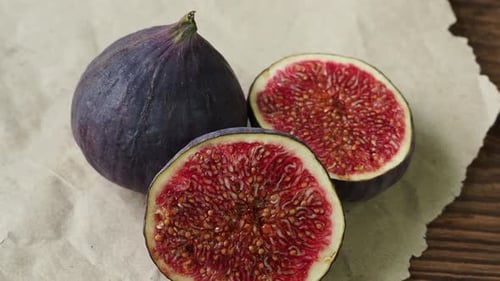 Fig close up on wrinkled paper and wood