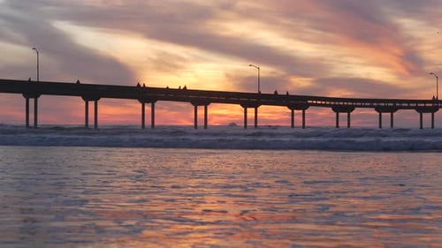 Pier in Sea Water on Beach