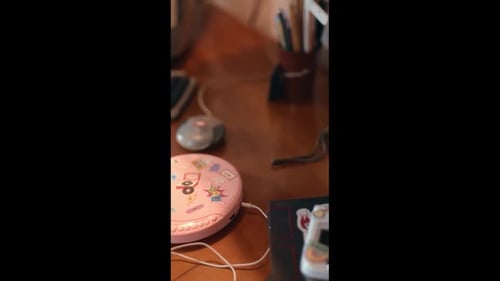 Vertical Pan Down Over Y2K Devices and CD Player
