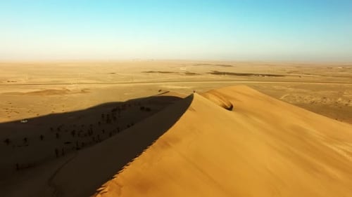 Travel, desert and sunset with drone of sand dunes for destination, freedom and summer journey