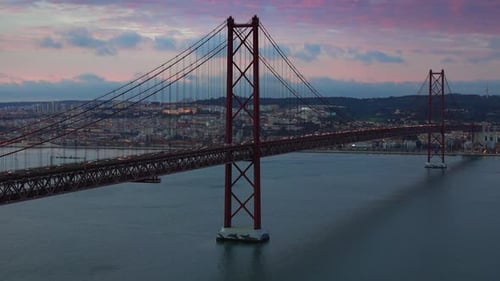 Bridge of 25th April with car traffic after sunset