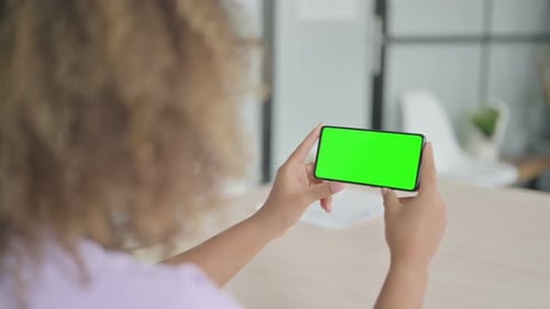 African Woman Using Smartphone with Chroma Key