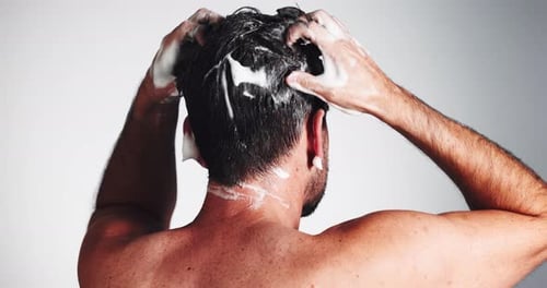 Man Shampooing Hair in Close Up Shot
