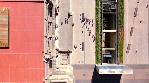 Boom up aerial view of a group of people at the Teatro Colon square, downtown Buenos Aires, Argentin