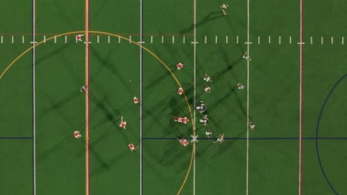 American Football Teams of Play at Night Time Aerial Top Down Shot Footage