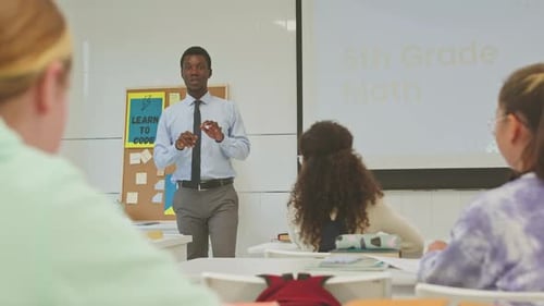 Enthusiastic Teacher Leading Sixth Grade Math Lesson