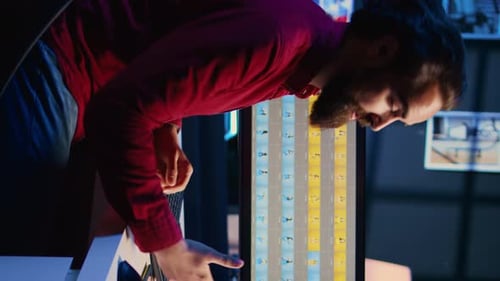 Adult Working on Tablet in Dark Office