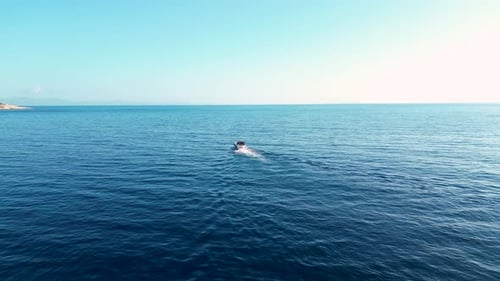 Motorboat in the sea riding towards open waters