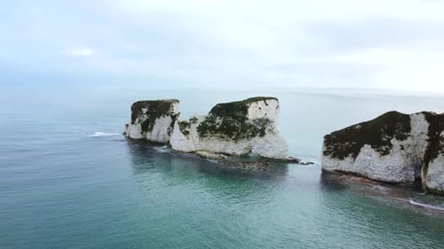 Drone shot of Old Harry Rocks with an ocean backdrop in Dorset, England