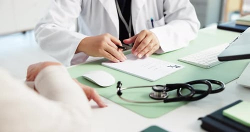 Doctor Writes Prescription for Patient in Office