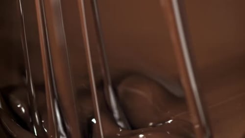 Rich Chocolate Sauce Pouring in Close-Up Shot