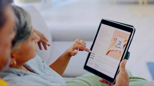 Woman Looking at Tablet Device with Man