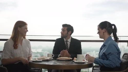 White collar worker meeting at high rise tower.