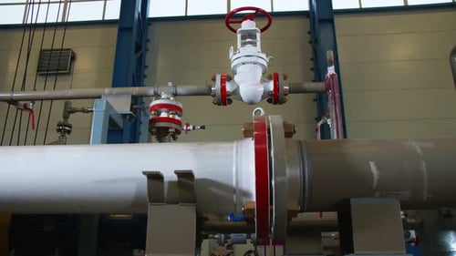 White and Brown Pipes with Level at Gas Compression Station