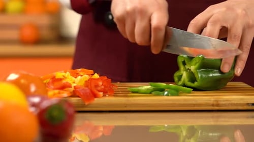 Slicing Green Bell Pepper on Cutting Board
