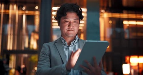 City, tablet and business Asian man in dark for communication, typing email and networking