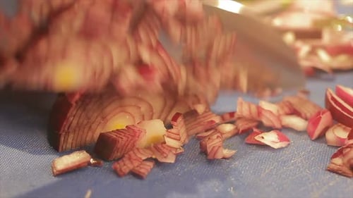 Dicing Red Onion with a Knife on Board