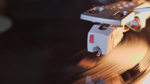 Playing a vinyl record - extreme close-up shot, cartridge and stylus. Scene C.