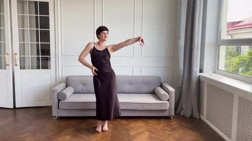 Woman Dancing Gracefully in Modern Interior