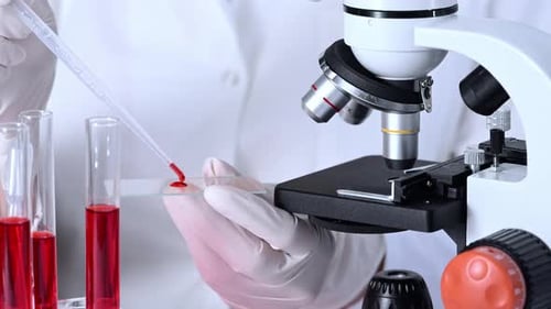 Close Up Preparing a Blood Sample for Microscope