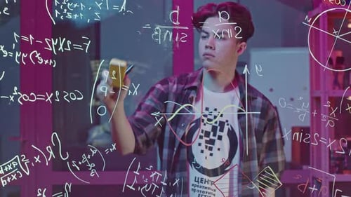 Young Adult Writing Equations in Bright Lab